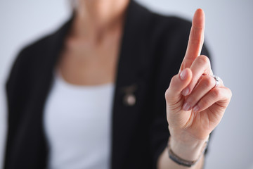 Woman touching an imaginary screen with her finger - isolated