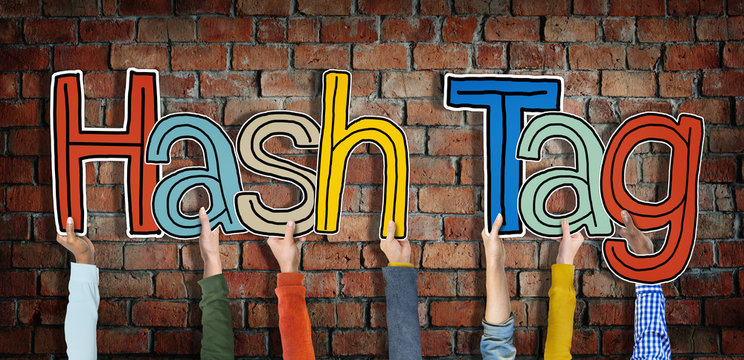 Group of Hands Holding Word Hash Tag Concept