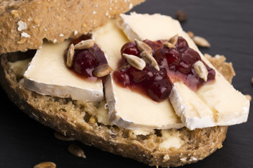 bread served with camembert and cranberry