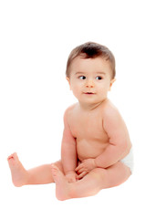 Adorable six month baby in diaper looking at side