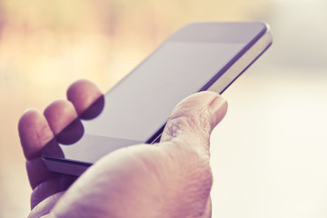 Man Holding a Mobile Phone