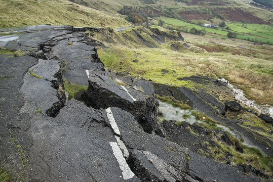 Landscape of collapsed A625 road in Peak District UK