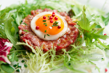 Beef tartare in plate, close-up