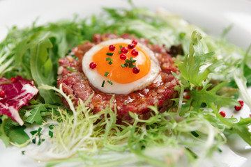 Beef tartare in plate, close-up