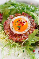 Beef tartare in plate, close-up