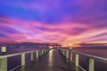 Fototapeta na wymiar Landscape of Wooded bridge in the port between sunrise.