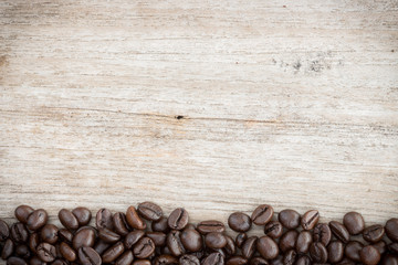 coffee beans on grain wood background