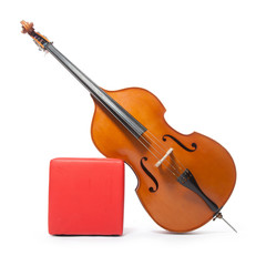 double bass leans against red box