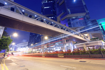 Obraz premium traffic light trails at modern city street,hongkong.