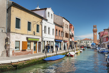 Obraz na płótnie Canvas Murano island canal, colorful houses and boats, Venice, Italy.