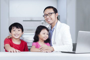 Friendly doctor with children