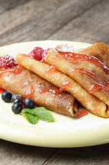 Crepe with raspberries and blueberries