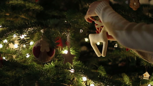 Woman Decorating Christmas Tree