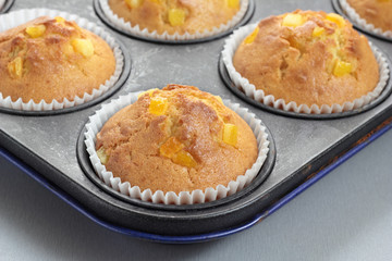 Muffins with orange zest just taken from the oven.