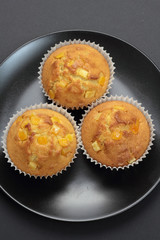 Muffins with orange zest just taken from the oven.