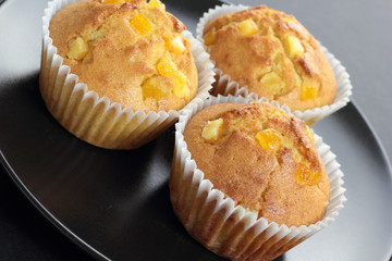 Muffins with orange zest just taken from the oven.