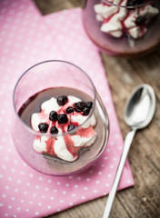 Chocolate pudding with whipped coconut cream