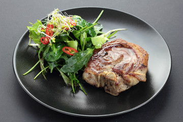Roasted lamb with rocket, lettuce, sprout and chili salad.