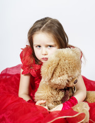 Cute little girl  with her teddy-bear toy friend