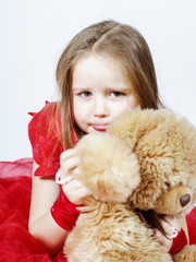 Cute little girl  with her teddy-bear toy friend