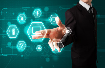 Businessman pressing virtual media type of buttons