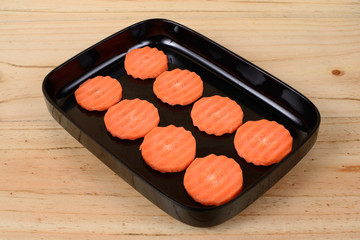 Carrot in a black tray.