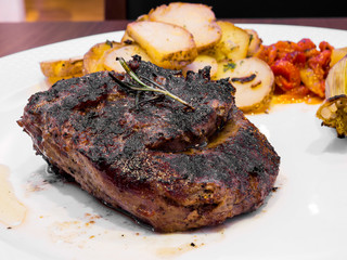 Beef steak on white dish