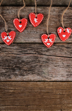 Hearts on wooden background. Valentine's day