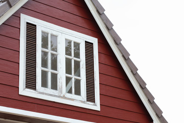 attic with white wood window on the roof house