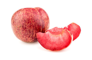 Whole pluot fruit with delicious juicy slices on white
