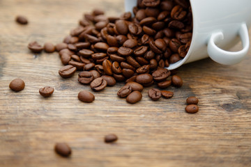 Coffee cup filled with coffee beans