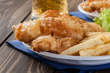 Fish and chips with tartar sauce on a plate