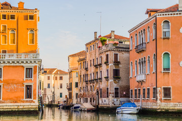 Fototapeta na wymiar Venice cityscape - residential houses and boats on water canal