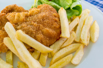 schnitzel with chips and salad