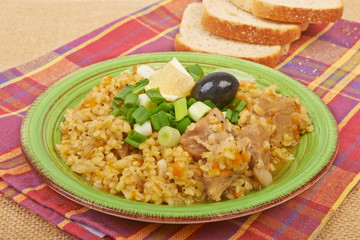 Porridge in a dish seasoned with chives