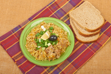 Porridge in a dish seasoned with chives