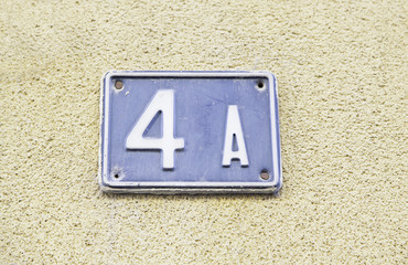 Number four on the wall of a house