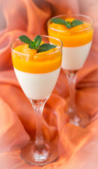 Panna cotta with Mandarin jelly. Shallow depth of field