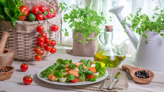 Fresh vegetables and salmon as ingredients for salad