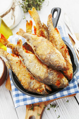 Fried fish in a frying pan