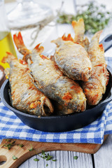Fried fish in a frying pan