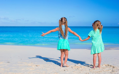 Fototapeta premium Little adorable girls during tropical summer vacation