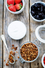 granola with yogurt, nuts, goji berries and strawberries