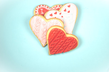 Some heart-shaped biscuits on a light bluw background