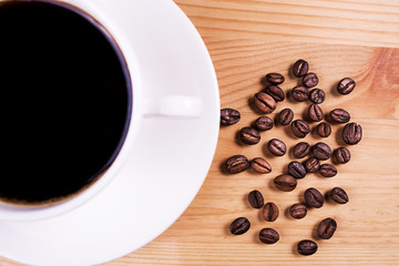 Fototapeta premium cup of coffee with coffee beans