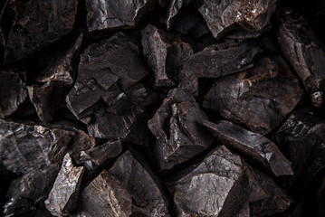 Coal lumps on dark background