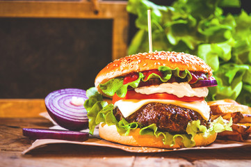 Juicy and fragrant hamburger with fries homemade copy space for