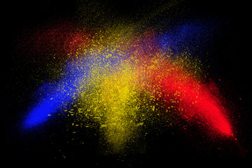 Fototapeta na wymiar Freeze motion of colorful powder exploding