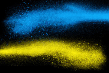 Freeze motion of colorful powder paint exploding - obrazy, fototapety, plakaty
