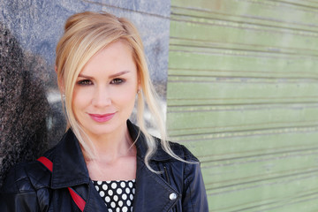 Gorgeous Blond Woman Leaning on the Wall